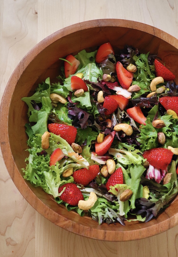 strawberry tops salad with mixed greens, cashews, pistachios