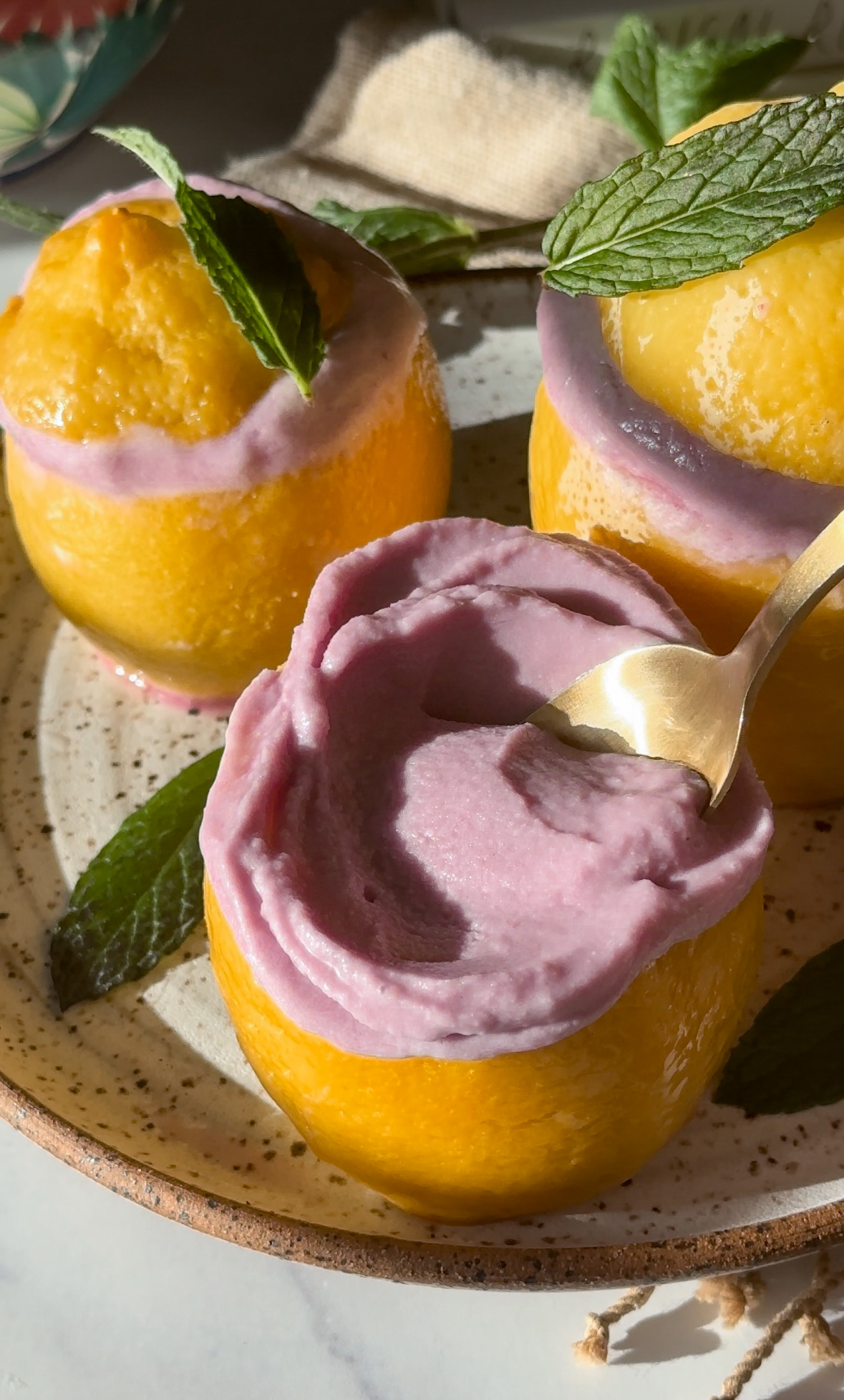 vegan lemon lavender ice cream (healthy and dairy free) served in lemon rind cups