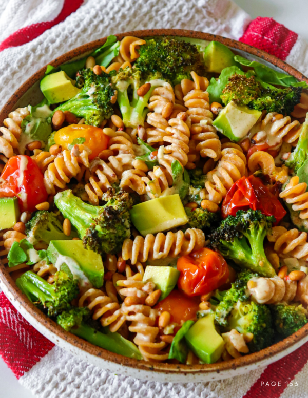 roasted broccoli and cherry tomato pasta with pine nuts, avocado and lemon garlic tahini sauce